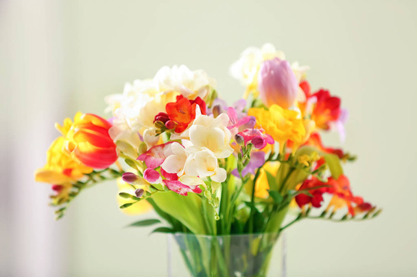 Beautiful bouquet of freesia flowers on blurred background - Valokuva, kuva