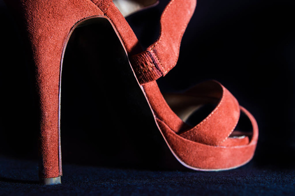 detail at red female high heels shoes on a black background - Φωτογραφία, εικόνα