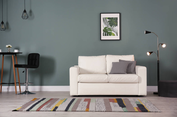 Stylish living room interior with comfortable sofa - Valokuva, kuva