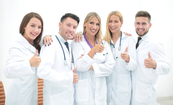 professional medical team showing thumb up - Foto, imagen