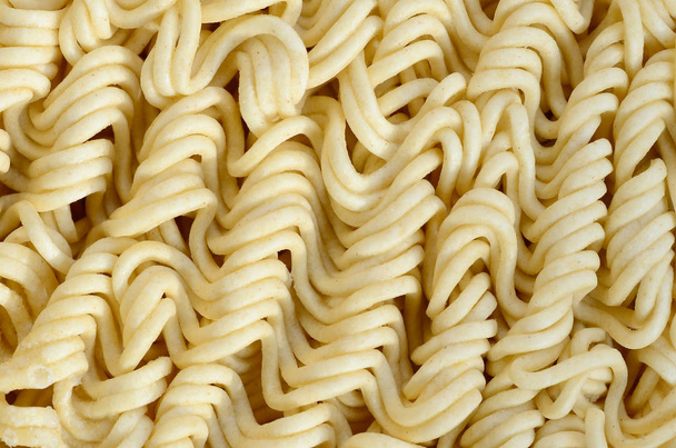 Close up view of yellow dry instant noodles. Chinese traditional food - Photo, Image