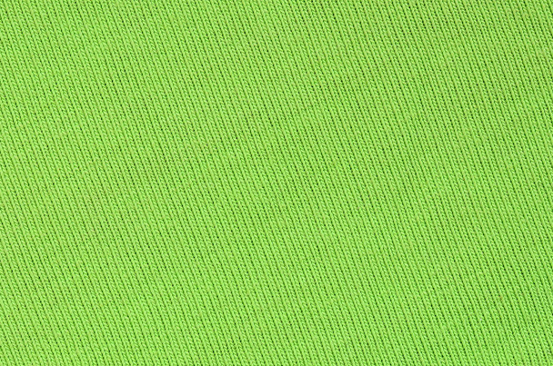 Η υφή του υφάσματος είναι έντονο πράσινο. Υλικό για την κατασκευή πουκάμισα και μπλούζες - Φωτογραφία, εικόνα
