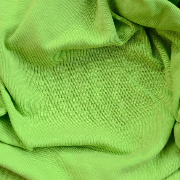 生地の質感は、明るいグリーンです。シャツやブラウスを作るための材料 - 写真・画像