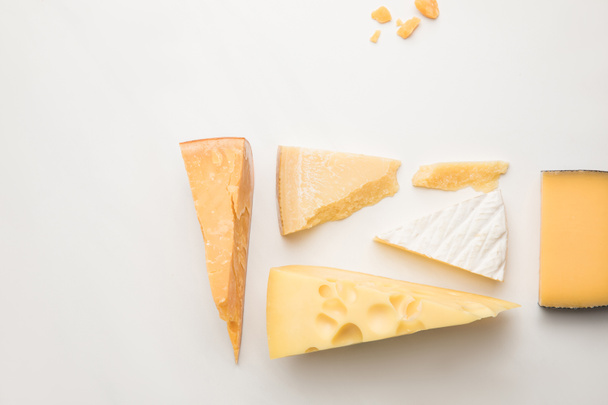 Top view of different types of cheese on white  - Photo, Image