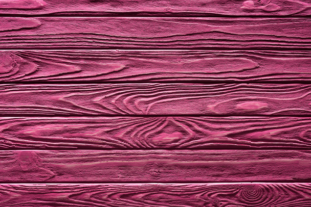 Wooden planks painted in pink background - Foto, imagen