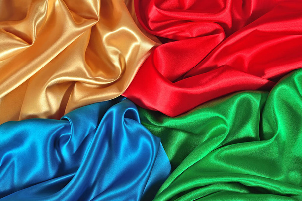 Textura de tela de satén natural azul, rojo, dorado y verde
 - Foto, Imagen