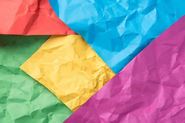Crumpled paper of different colors as a beautiful background - Foto, Bild