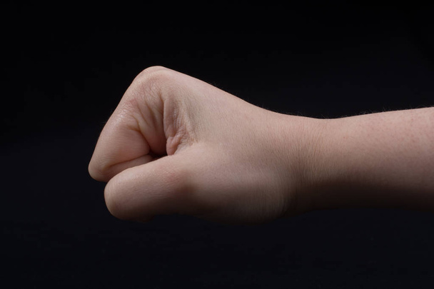 Hand closed for fist gesture in black - Foto, immagini