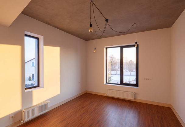 interior of an empty room with laminate and external wiring - Photo, Image