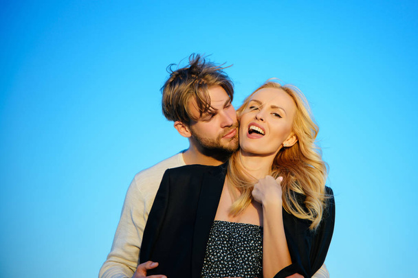 Muscular man and woman with long blond hair, love. - Fotoğraf, Görsel