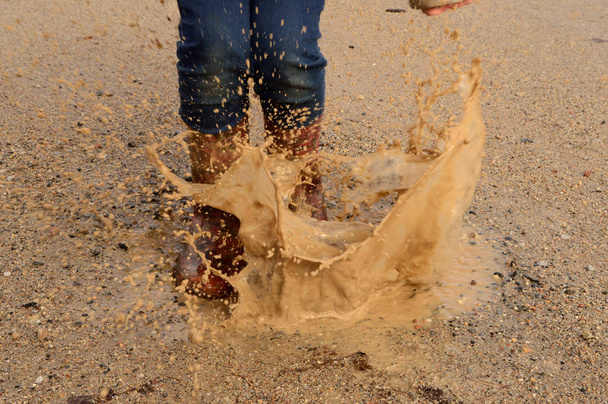 Rubber Boots Splashing Puddle - Фото, зображення