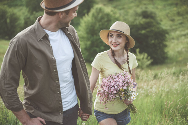 Happy young man and woman are spending time outdoors - Fotoğraf, Görsel