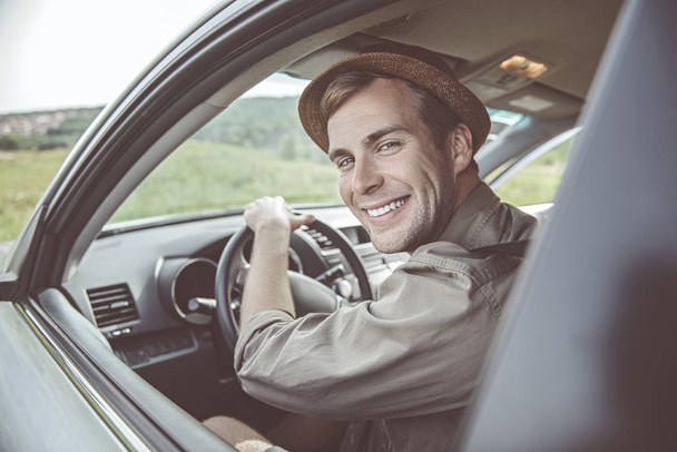 Active young man is traveling in his automobile - Foto, imagen