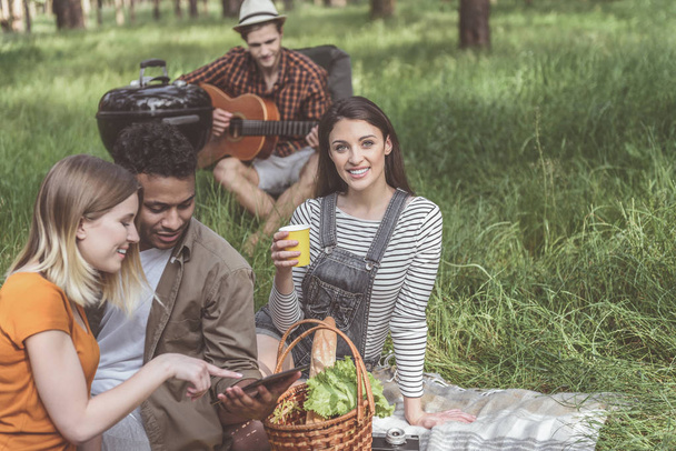 Carefree friends having good time at a picnic - Photo, image