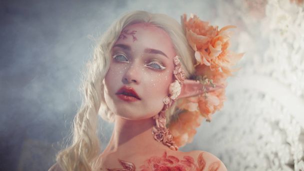 Young beautiful girl elf. Creative make-up and bodyart - Фото, изображение