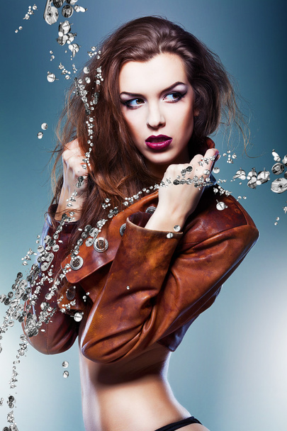pretty attractive erotic woman in brown jacket with silver - Fotografie, Obrázek