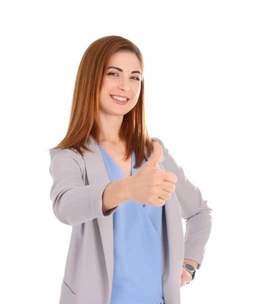 Beautiful young woman showing thumb up gesture on white background - Foto, imagen