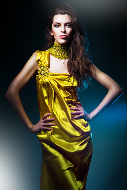 sensual beautiful woman in long yellow dress - Foto, afbeelding