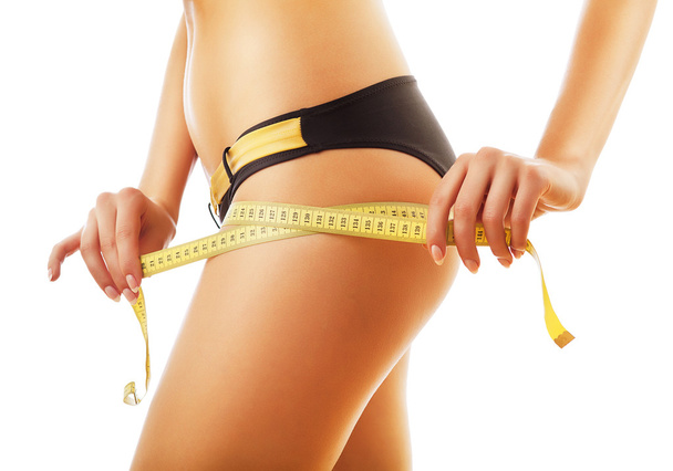 slimming woman measuring her body - Foto, Bild
