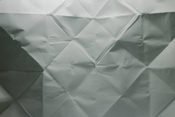 Folded paper texture in grey colours - Фото, изображение