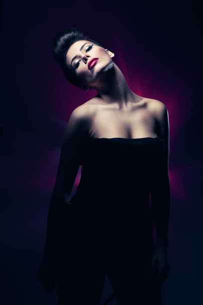 sexy hot woman with red lips in dark magenta light - Foto, Imagem