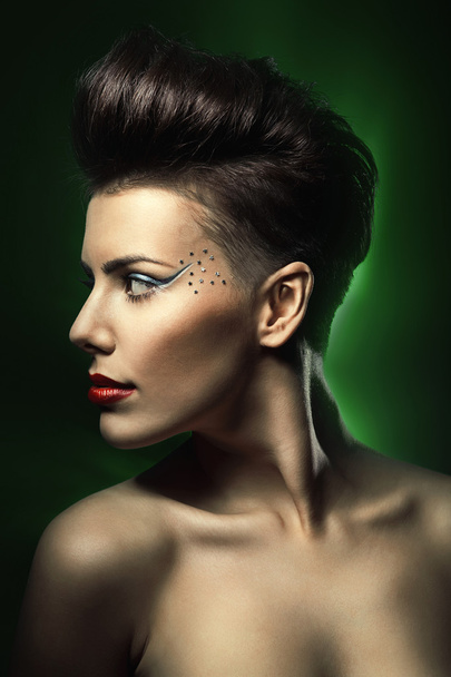 woman with red lips in dark green light - Photo, image