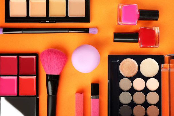 Flat lay composition with decorative cosmetics on color background - Photo, Image