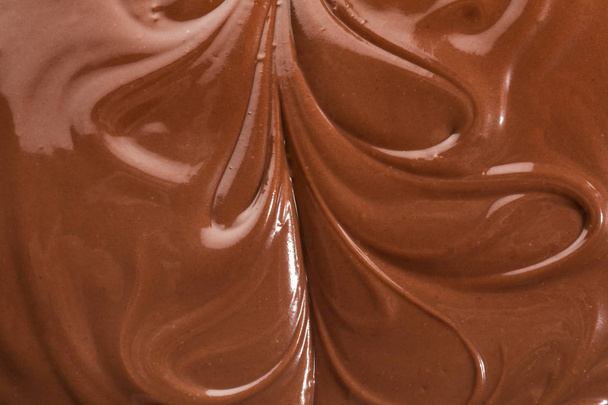 Ízletes olvasztott csokoládét mint háttér - Fotó, kép