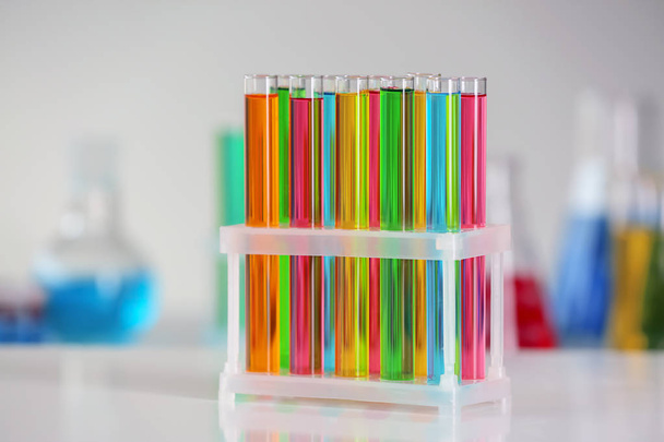 Test tubes with colorful samples in laboratory - Фото, зображення