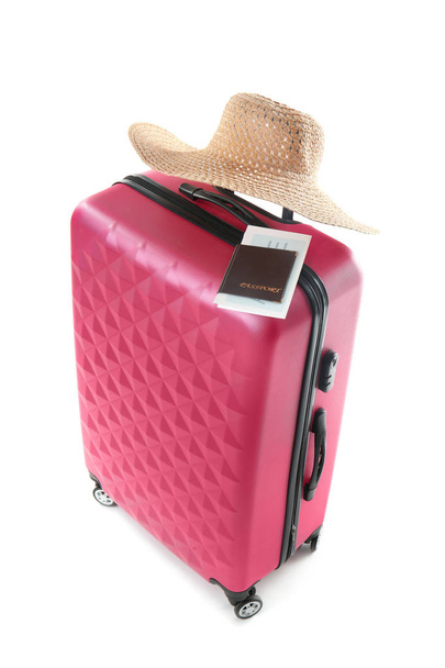 Large suitcase, hat and documents on white background - Foto, Imagen