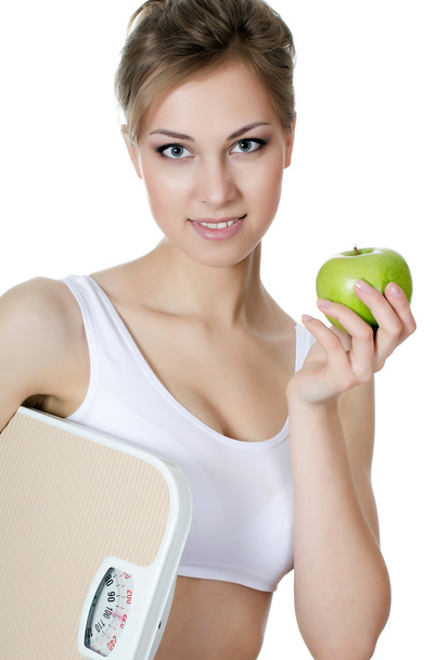 Beautiful girl with apple in hand - Фото, зображення