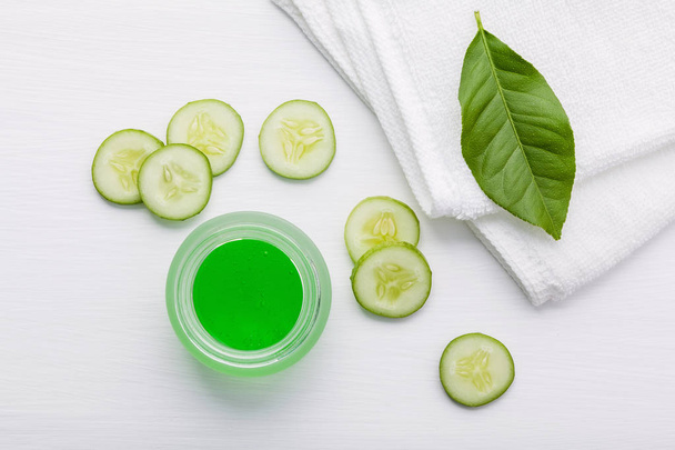 Natural herbal skin care products. Top view ingredients cucumber and aloe vera gel on table concept of the best all natural face moisturizer. Facial treatment preparation background. - Photo, Image