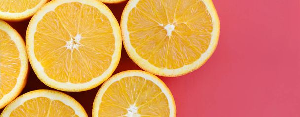 Top view of a several orange fruit slices on bright background i - Foto, afbeelding