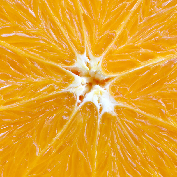 Вид зверху фрагмент апельсинового фруктового шматочка крупним планом. Текстура тла макросів
 - Фото, зображення