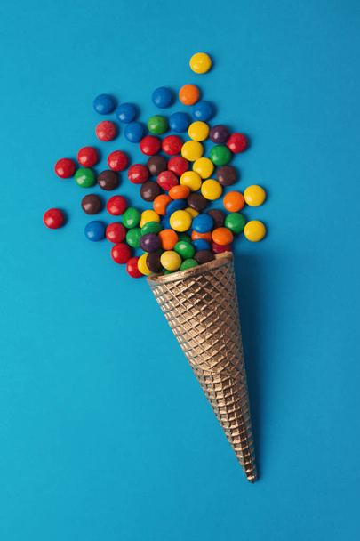 Ice cream in cornet with colorful bonbons - Photo, Image