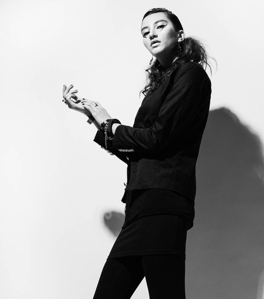 Fahion and people concept: Young fashion model posing in studio - Фото, зображення