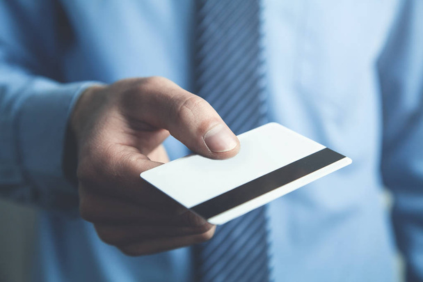 Businessman showing credit card. - Foto, Imagen