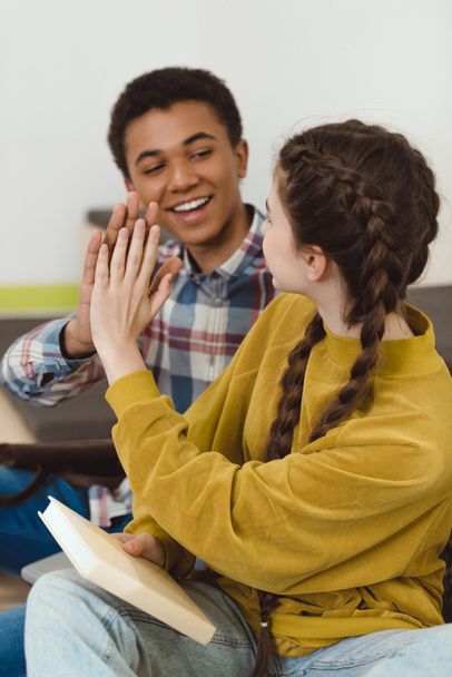 high school students couple giving high five - Photo, Image