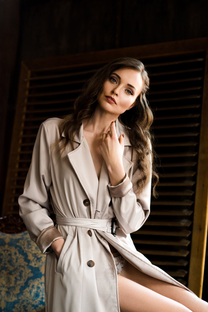 stylish sensual girl in beige trench coat   - Valokuva, kuva