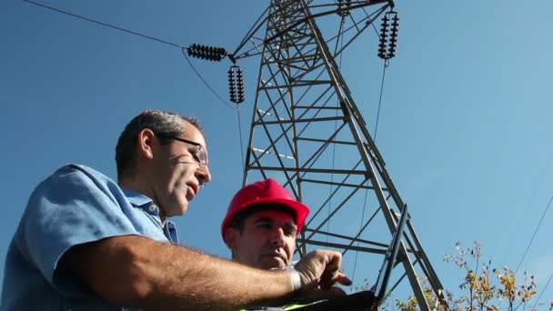 Electricians Under the High Voltage Tower - Footage, Video