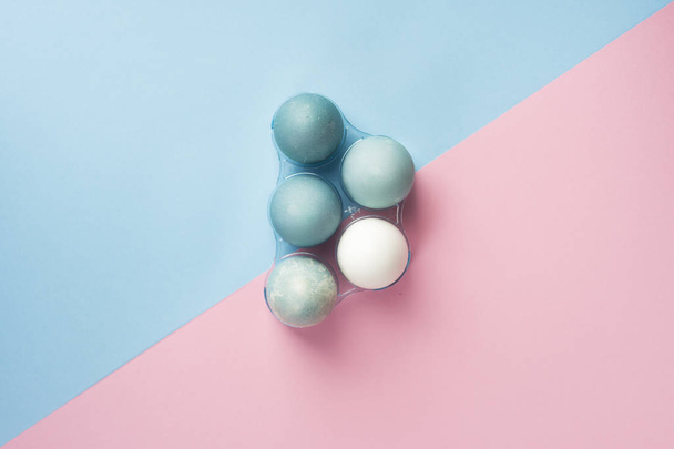 Conceptual still life photo of several blue eggs in plastic geom - 写真・画像