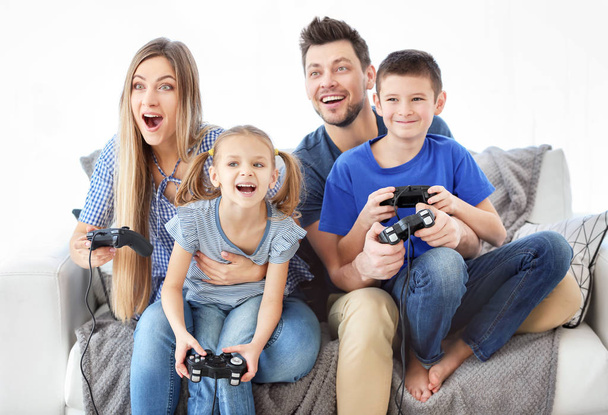 Happy family playing video games at home - Fotografie, Obrázek