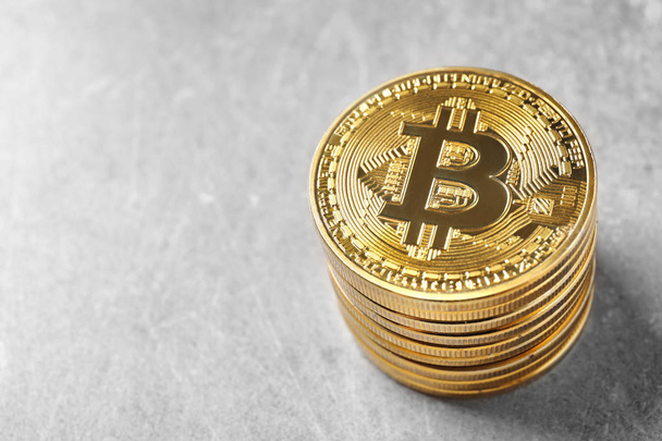 Golden bitcoins on light background. Finance trading - Zdjęcie, obraz
