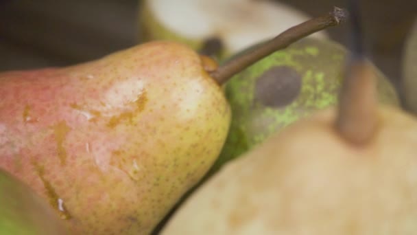 Slow motion close-up of pears and a glass of juice - Video
