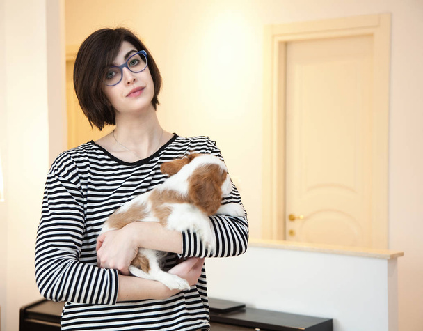 Young woman with puppy - Fotografie, Obrázek