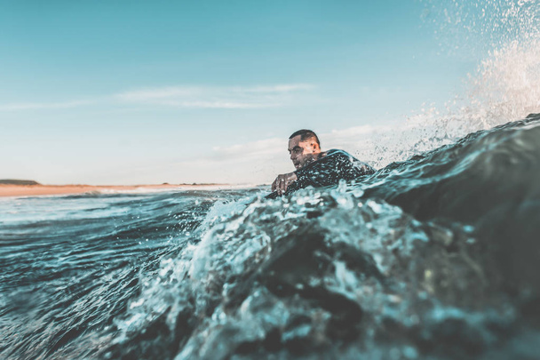 Surfer trying to catch a wave - Fotoğraf, Görsel