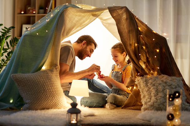 family playing tea party in kids tent at home - Foto, Imagem