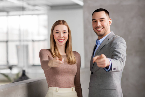 businesswoman and businessman pointing at you - Foto, afbeelding