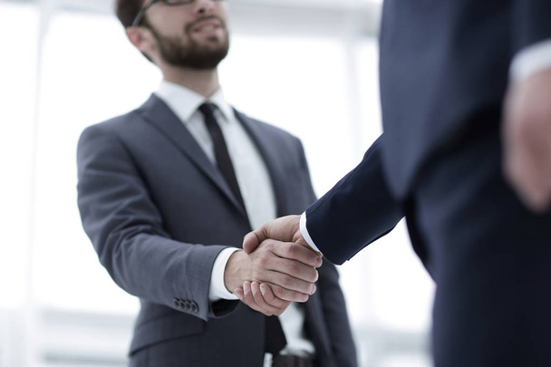 Two businessman shaking hands - Fotoğraf, Görsel