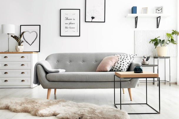 Cozy living room interior with comfortable sofa - Valokuva, kuva